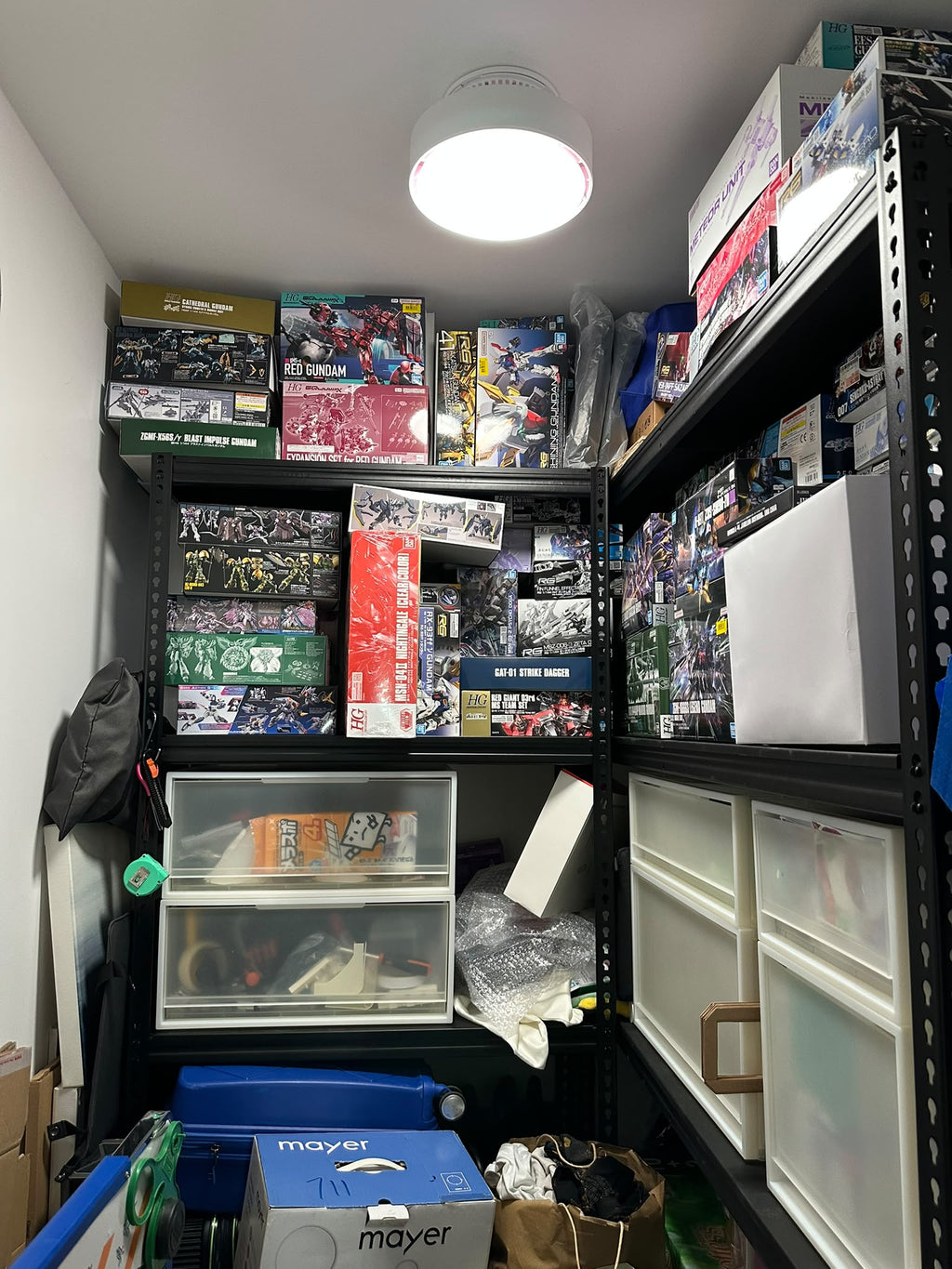 ALANTZ Aura-Flow Compact ceiling fan installed above storage shelves in a storeroom